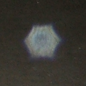 Hexagonal lens aperture-shaped dust orb, non-paranormal orb, Strange occurrences parannormal investigators, Welington New Zealand
